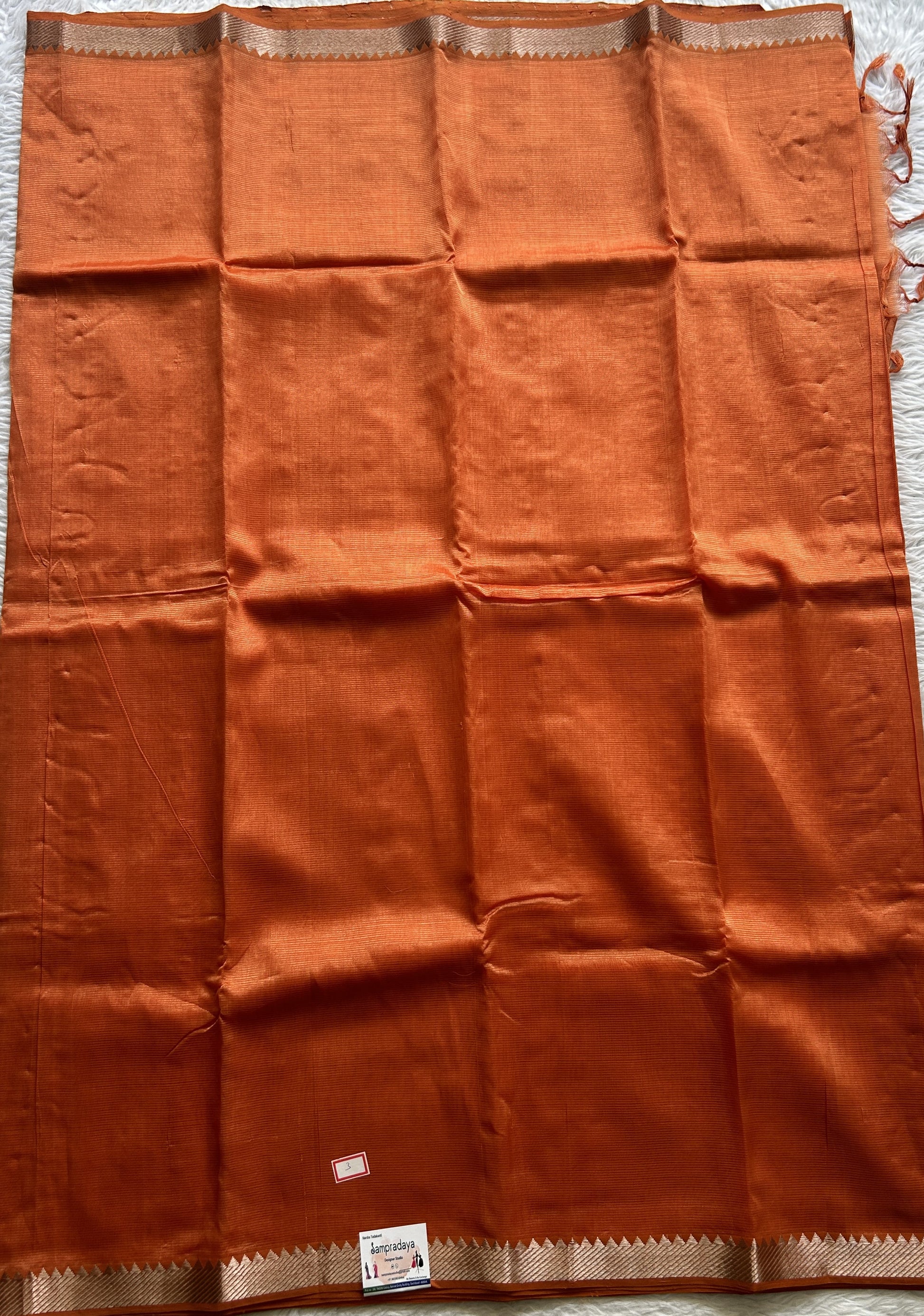 Mangalagiri Plain Pattu Saree Orange colored complemented with a Zari Border - Sampradaya Designer Studio