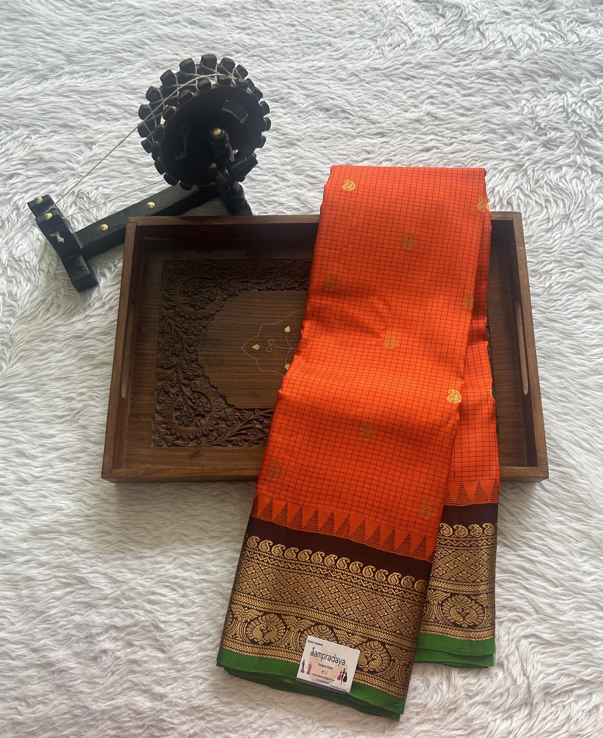 Gadwal Pattu Saree Orange colored saree complemented with a Zari border - Sampradaya Designer Studio