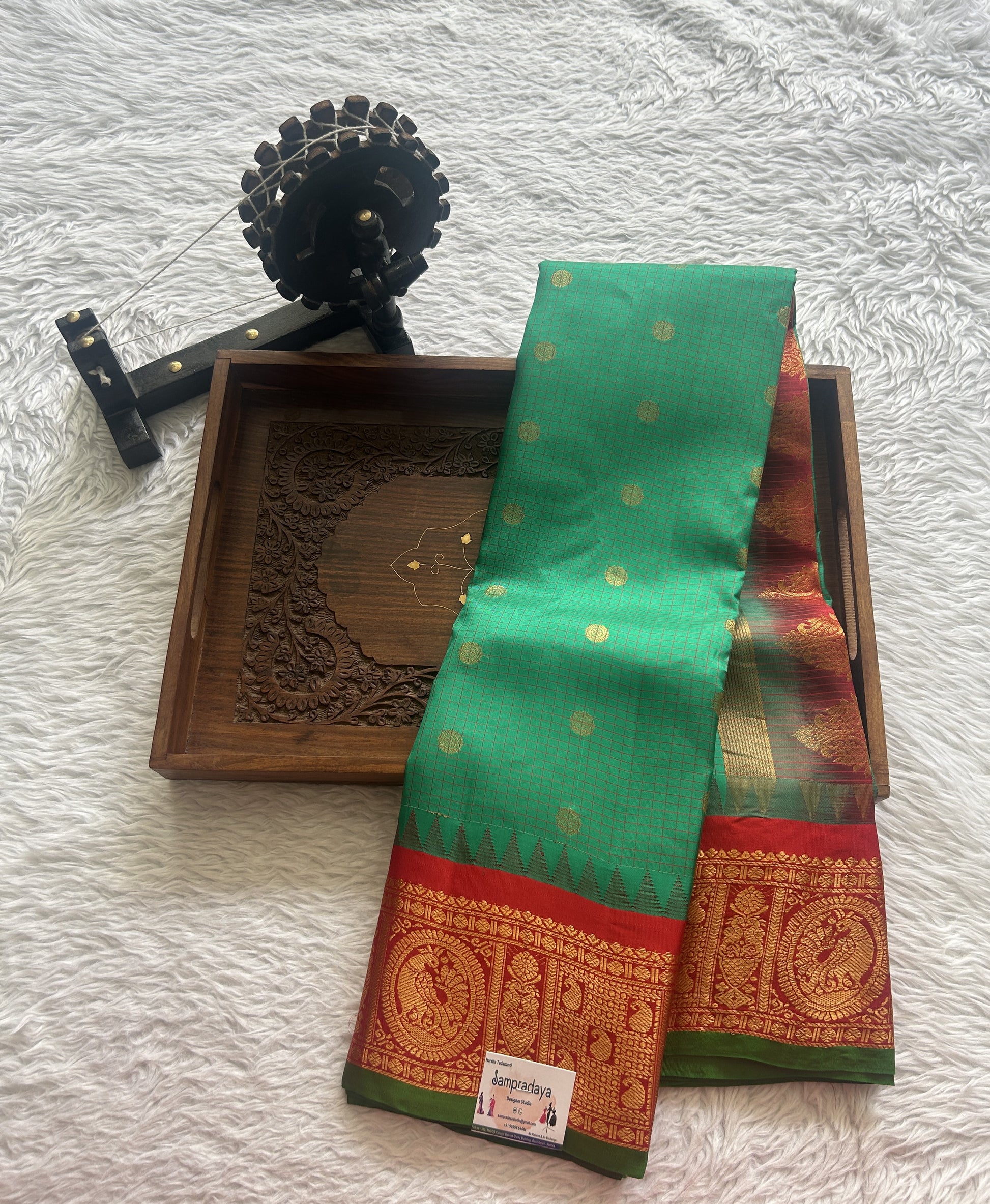 Gadwal Pattu Saree Dark Green colored saree complemented with a Zari border - Sampradaya Designer Studio