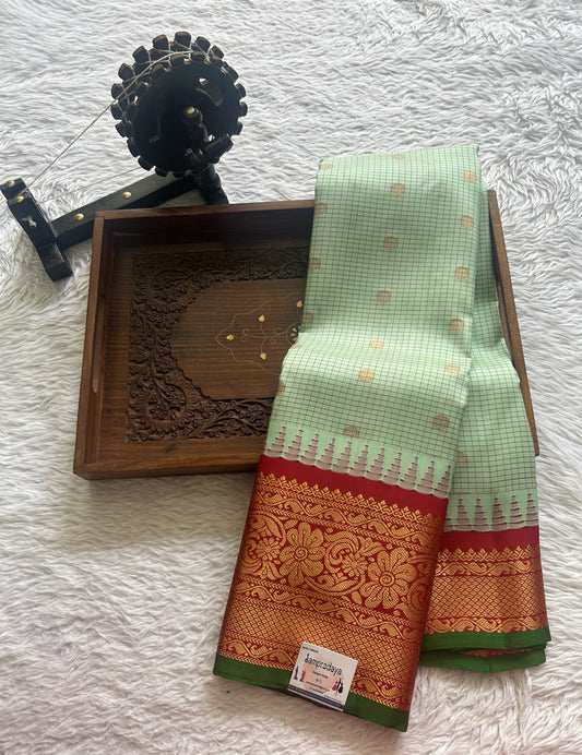 Gadwal Pattu Saree Pista Green colored saree complemented with a Zari border - Sampradaya Designer Studio