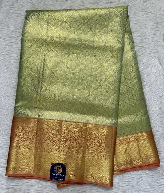 Kanjivaram Bridal Silk Saree Pastel Green colored Saree complemented with a Pastel Orange Color Gold Zari Weaving border. - Sampradaya Designer Studio