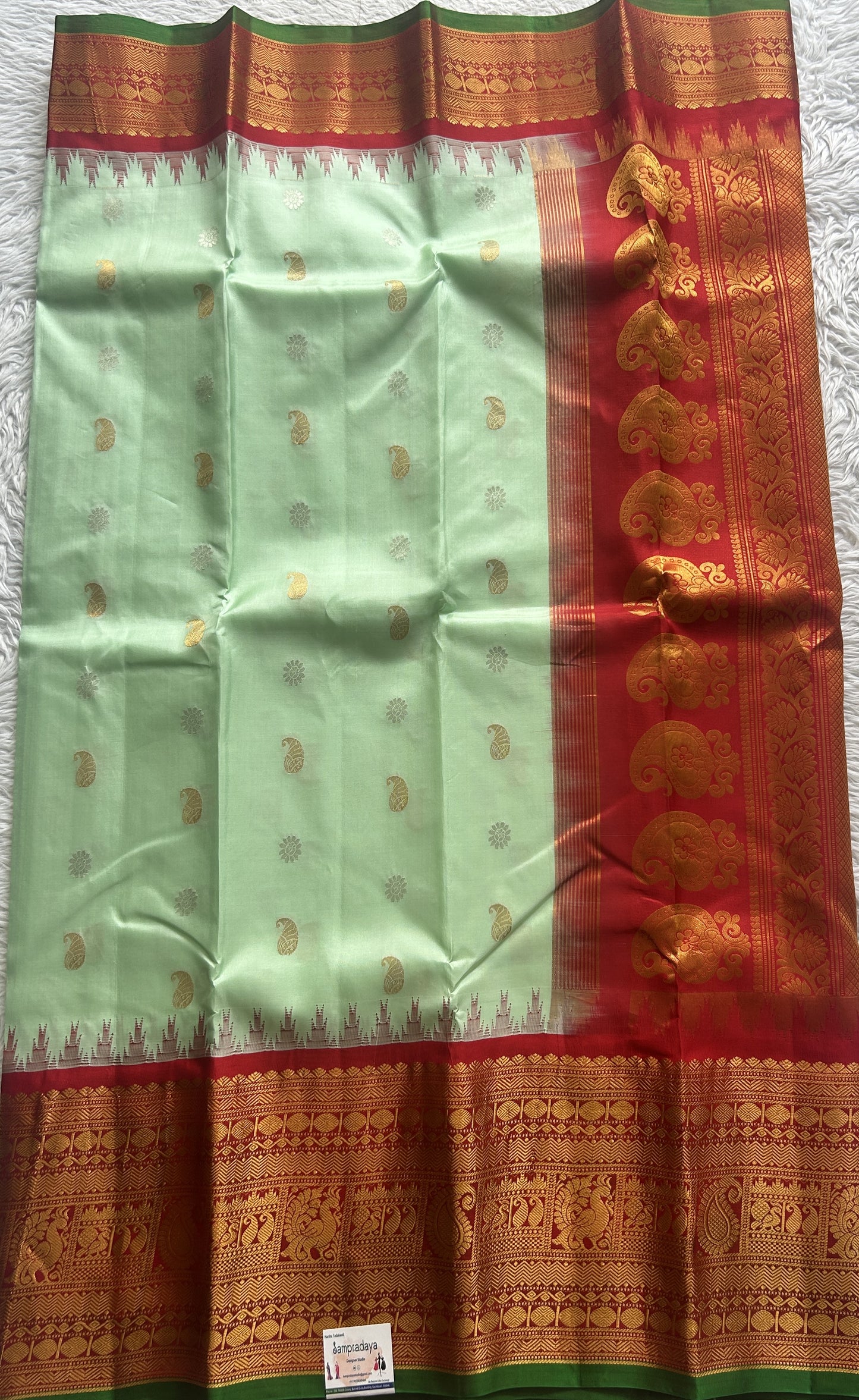 Gadwal Pattu Saree Light Green colored saree complemented with a Zari border - Sampradaya Designer Studio