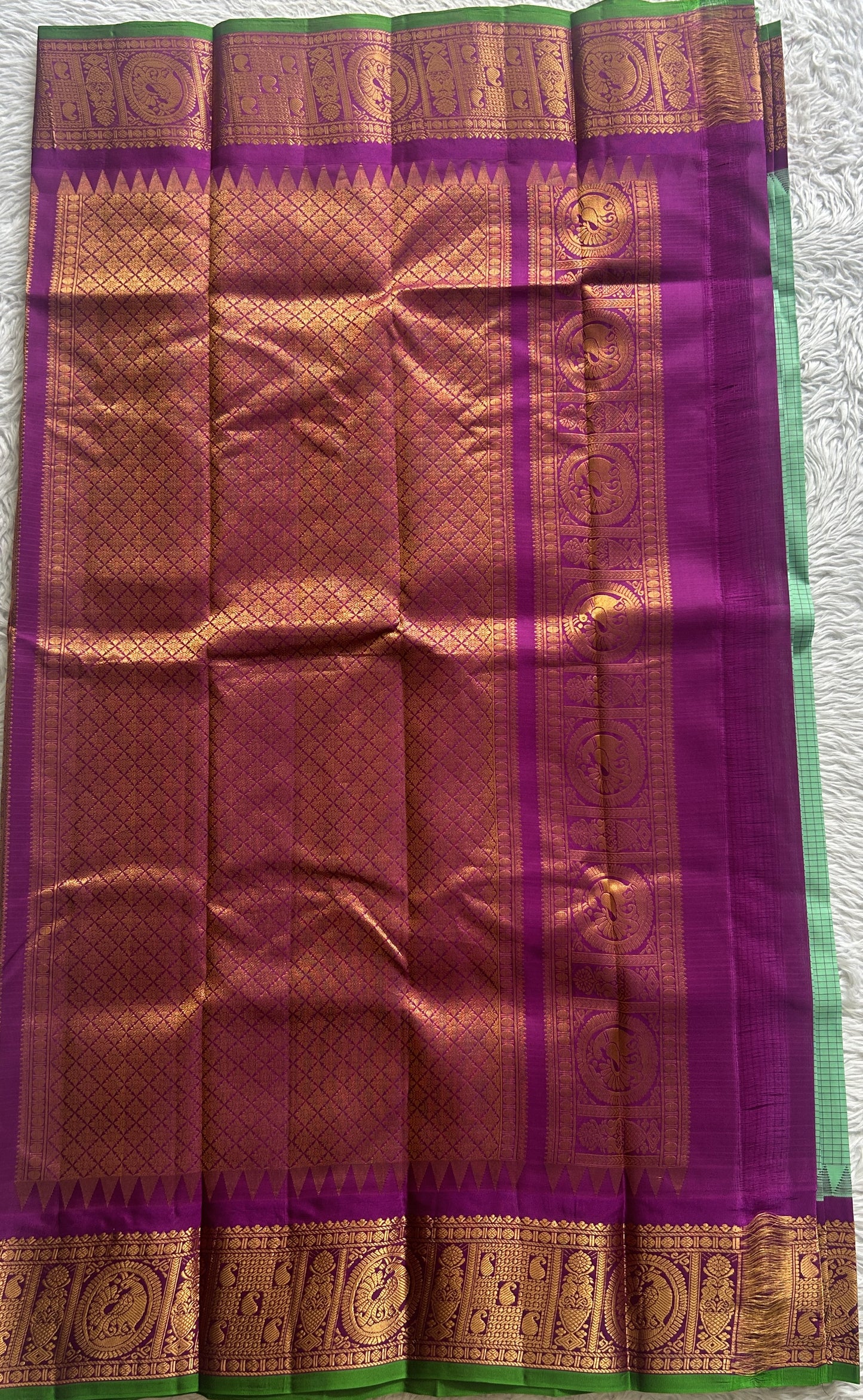 Gadwal Pattu Saree Light Green colored saree complemented with a Zari border - Sampradaya Designer Studio