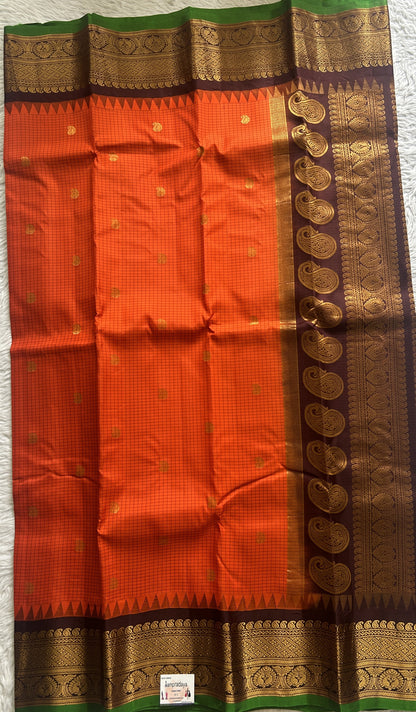 Gadwal Pattu Saree Orange colored saree complemented with a Zari border - Sampradaya Designer Studio