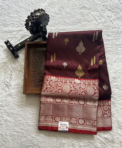 Venkatagiri Pattu Saree Brown Complemented With a Red Color Zari Border.