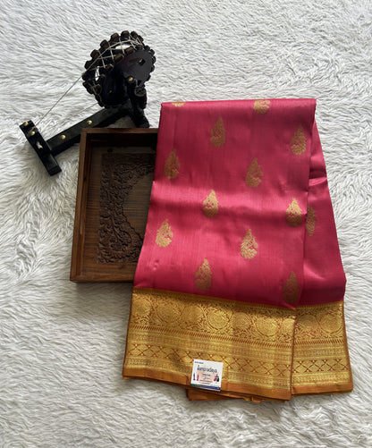 Venkatagiri Pattu Saree Pink Complemented With a Mustard Color Zari Border.