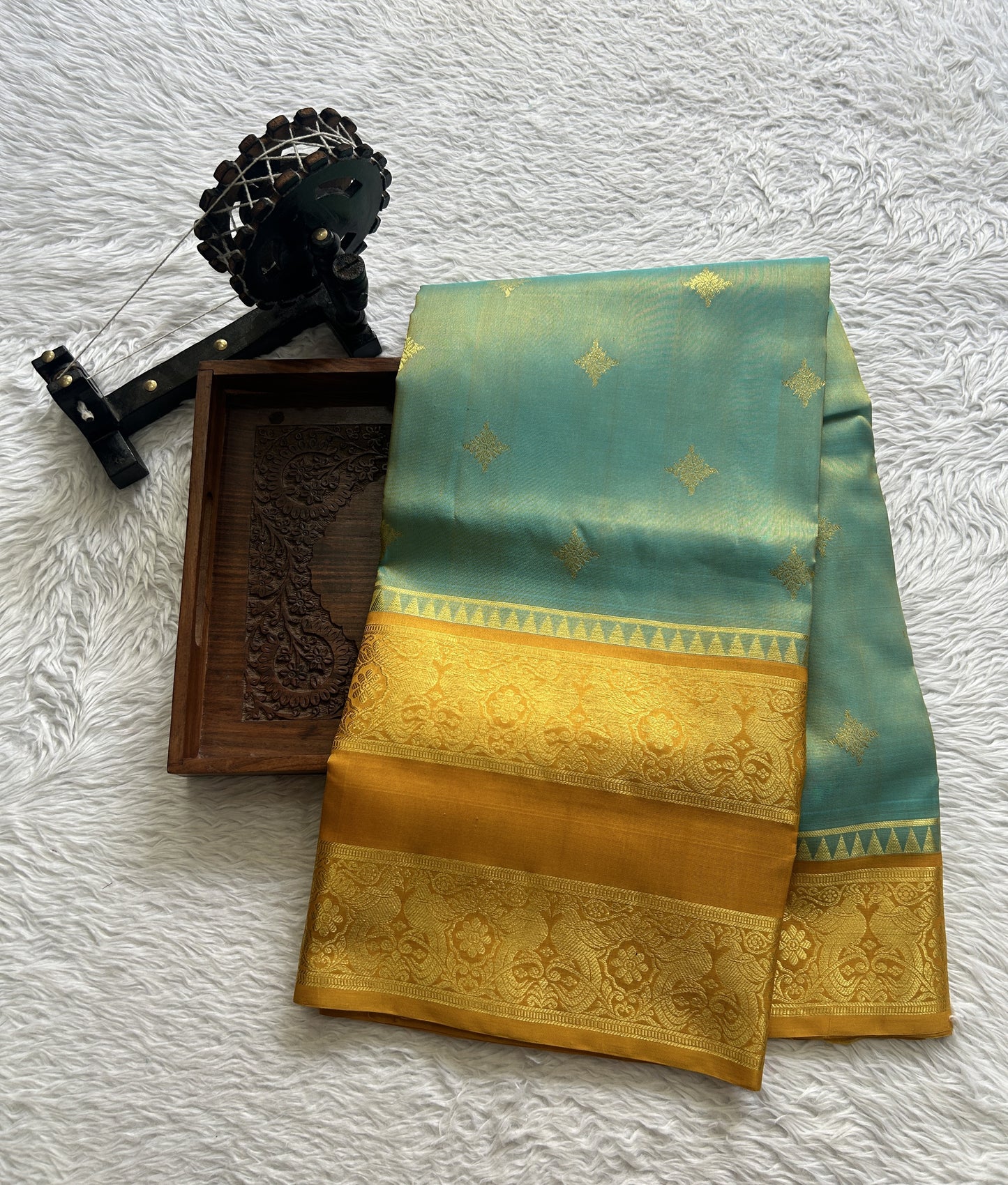 Venkatagiri Pattu Saree Sea Blue Complemented With a Mustard Color Zari Border.