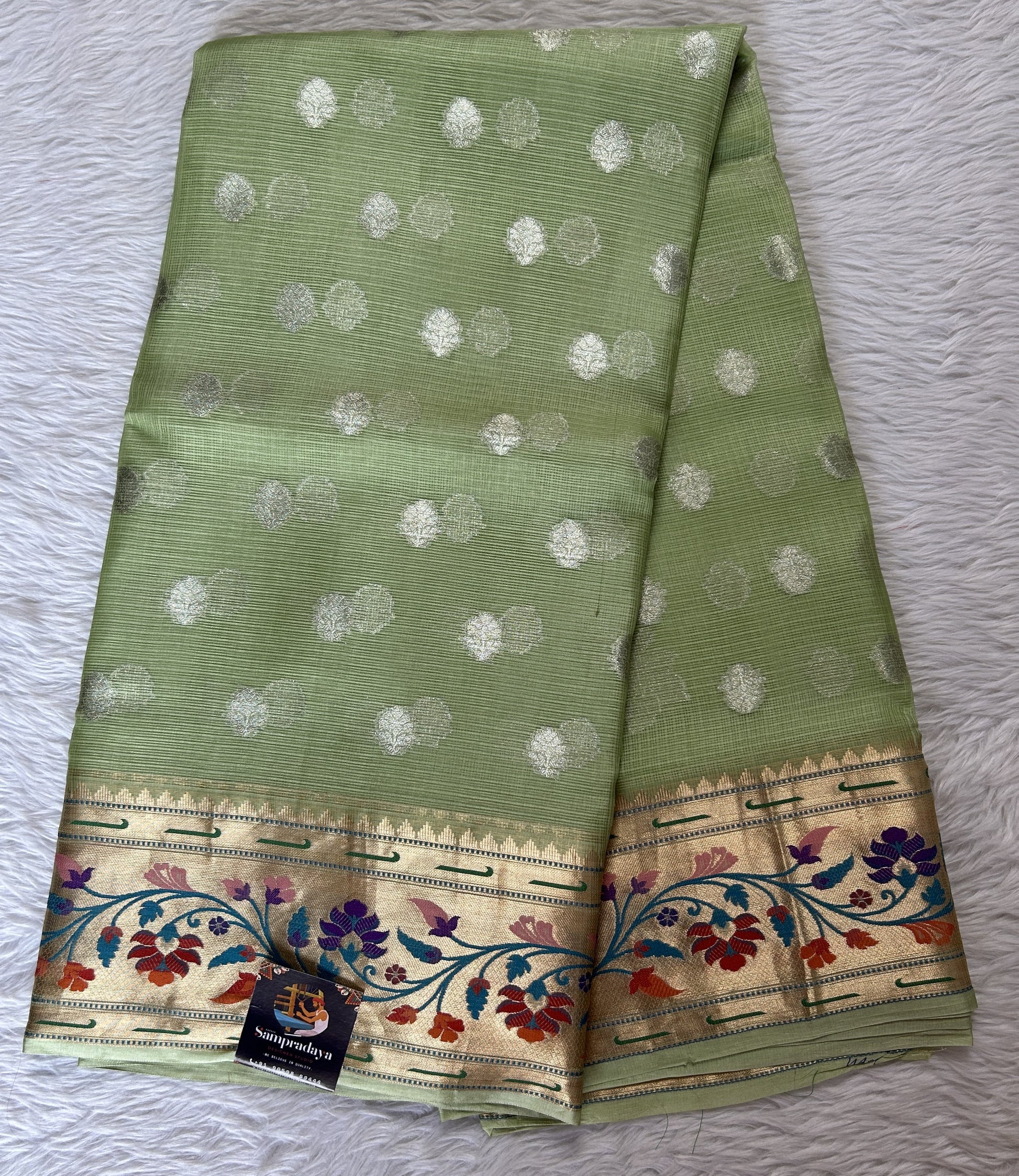 Silk kota Saree Green color complemented with a Zari Weaving Border. - Sampradaya Designer Studio