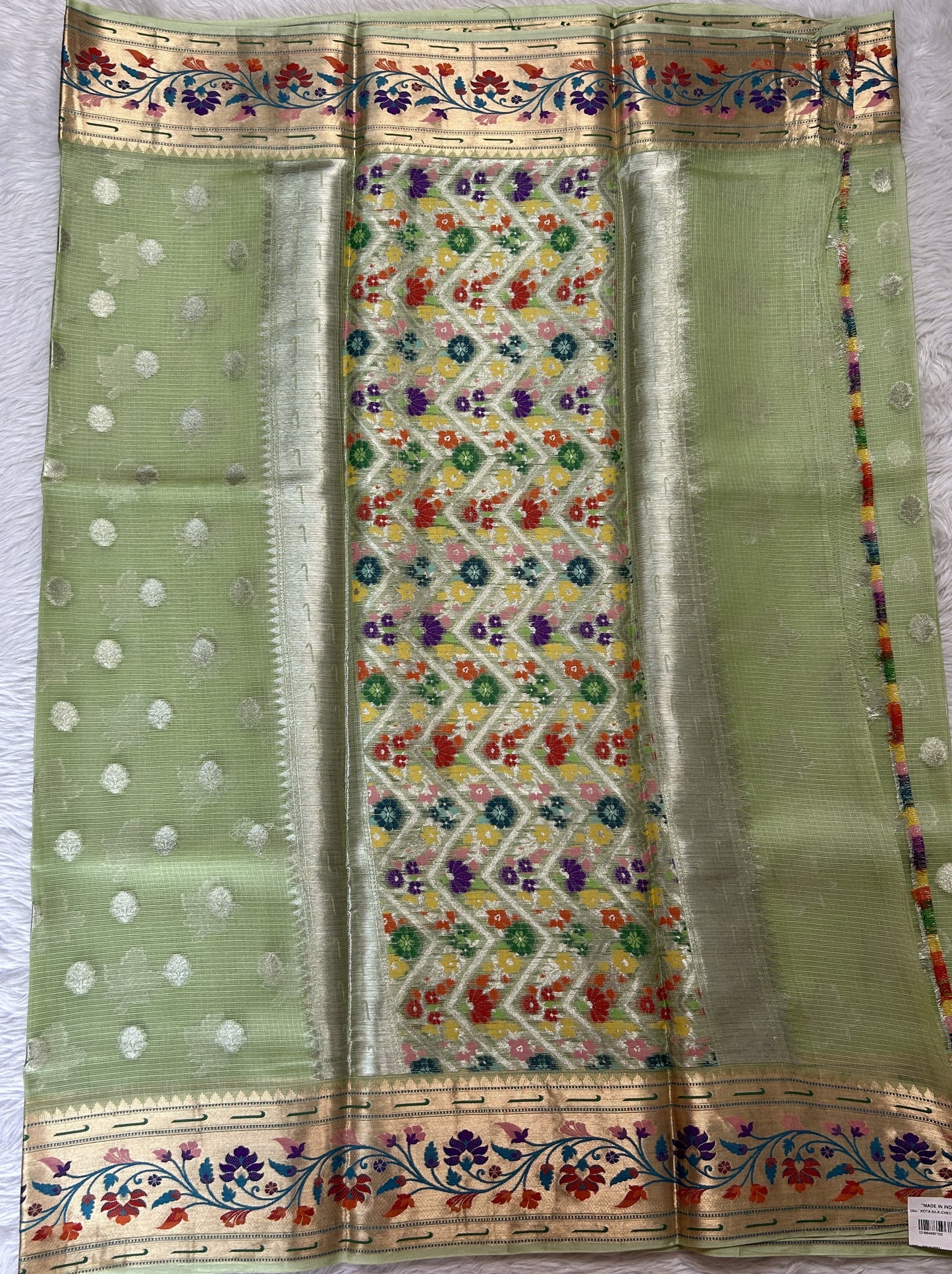 Silk kota Saree Green color complemented with a Zari Weaving Border. - Sampradaya Designer Studio