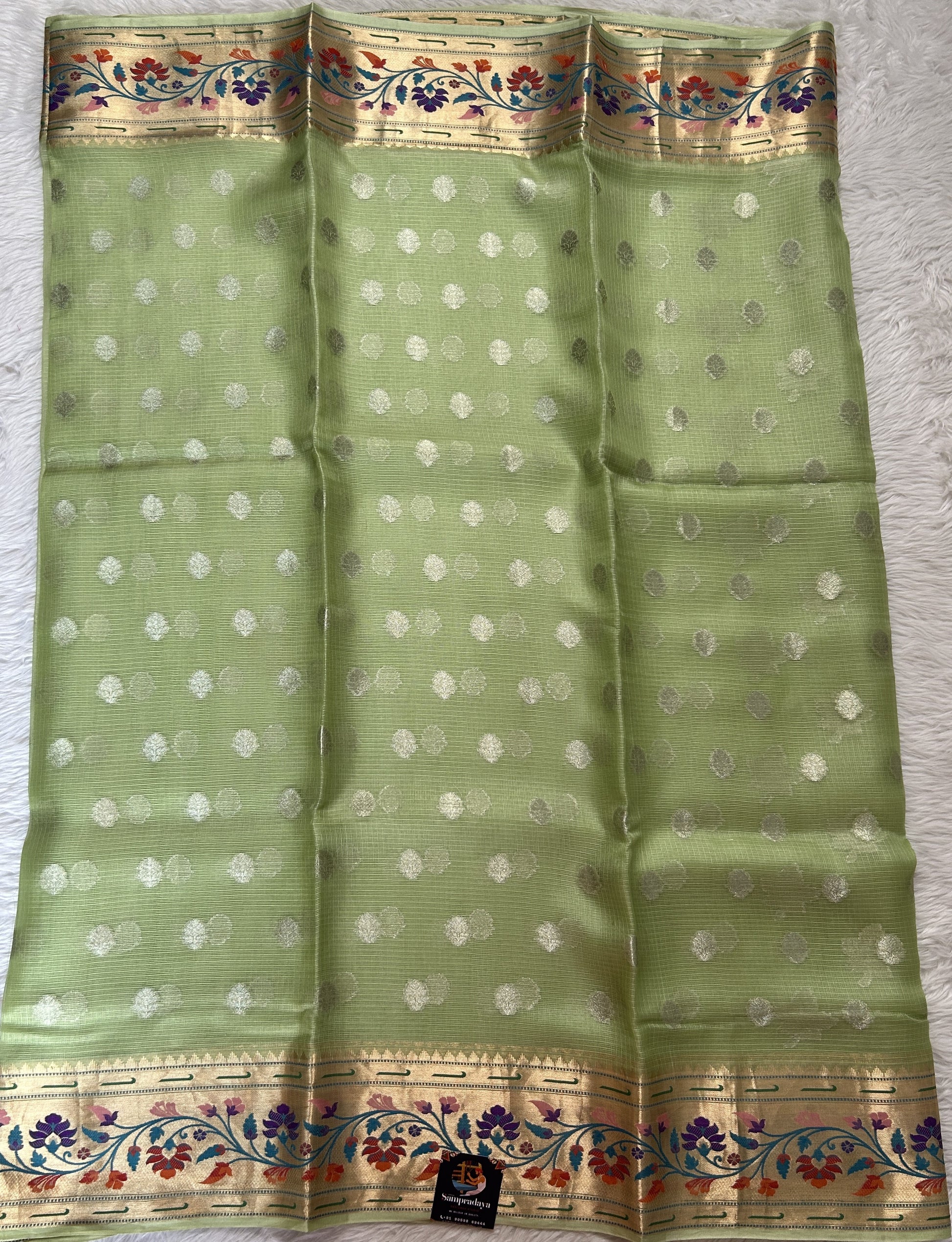 Silk kota Saree Green color complemented with a Zari Weaving Border. - Sampradaya Designer Studio