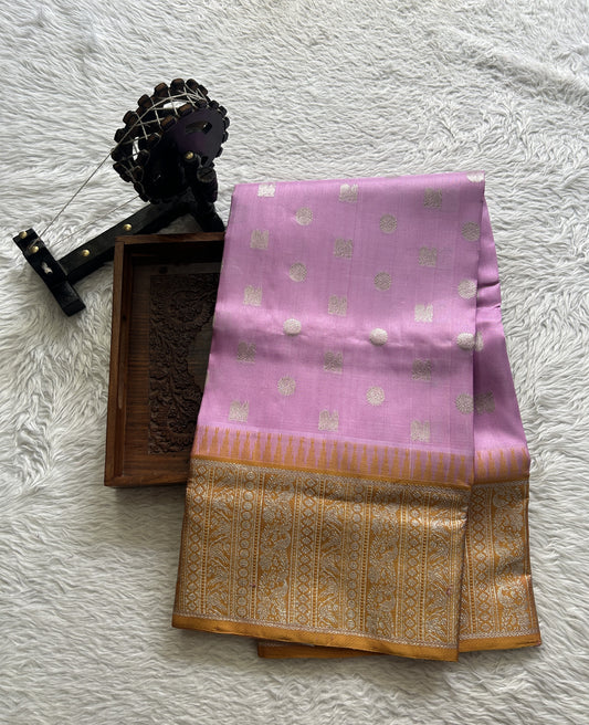 Venkatagiri Pattu Saree Baby Pink Complemented With a Mustard Color Zari Border.