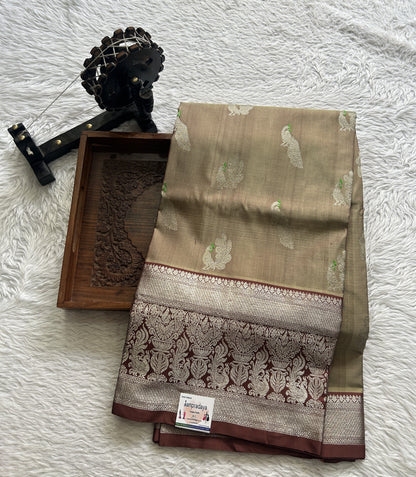 Venkatagiri Pattu Saree Olive Green Complemented With a Brown Color Zari Border.