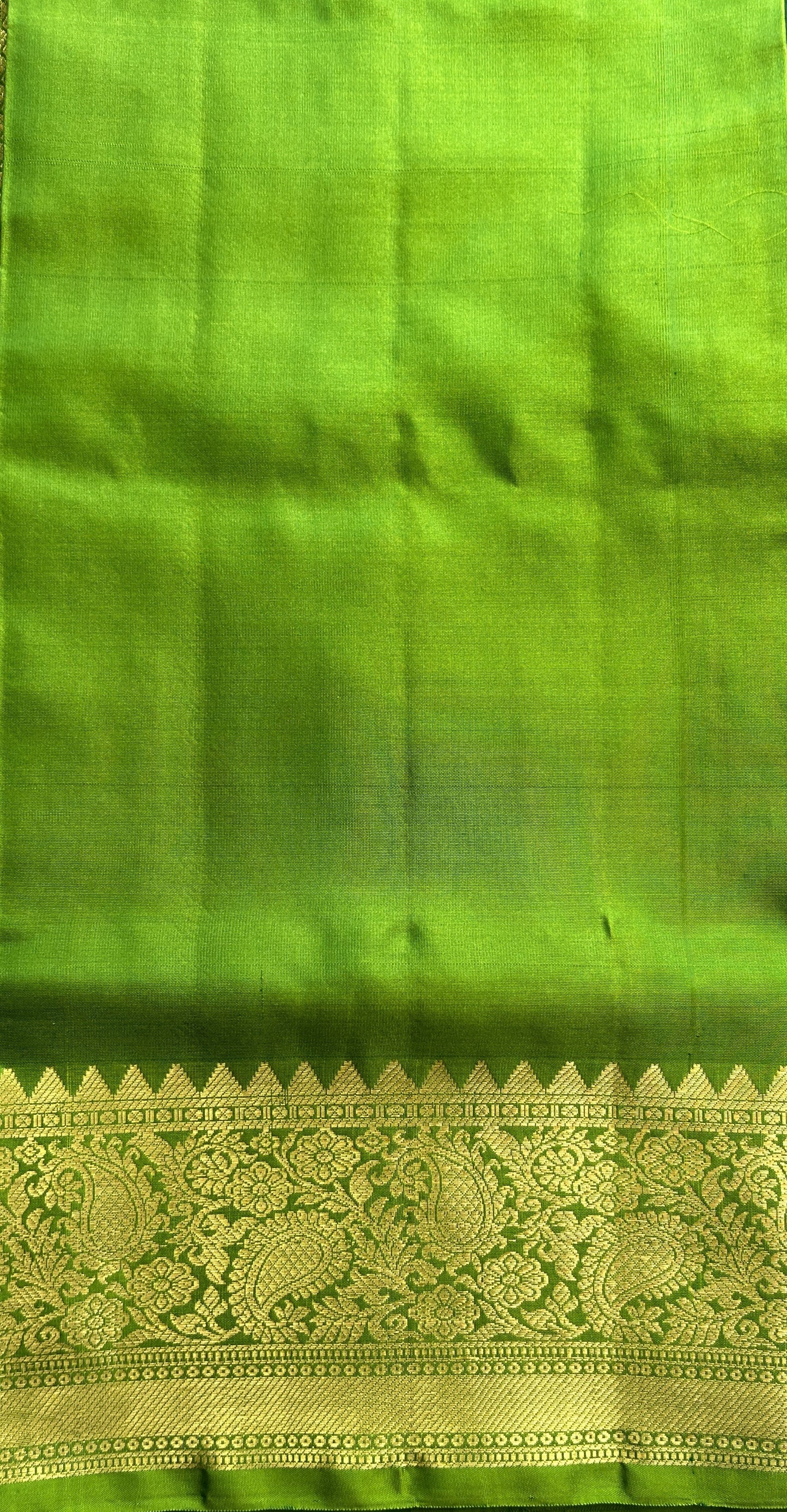 Venkatagiri Pattu Saree Dark Green Complemented With a Green Color Zari Border.