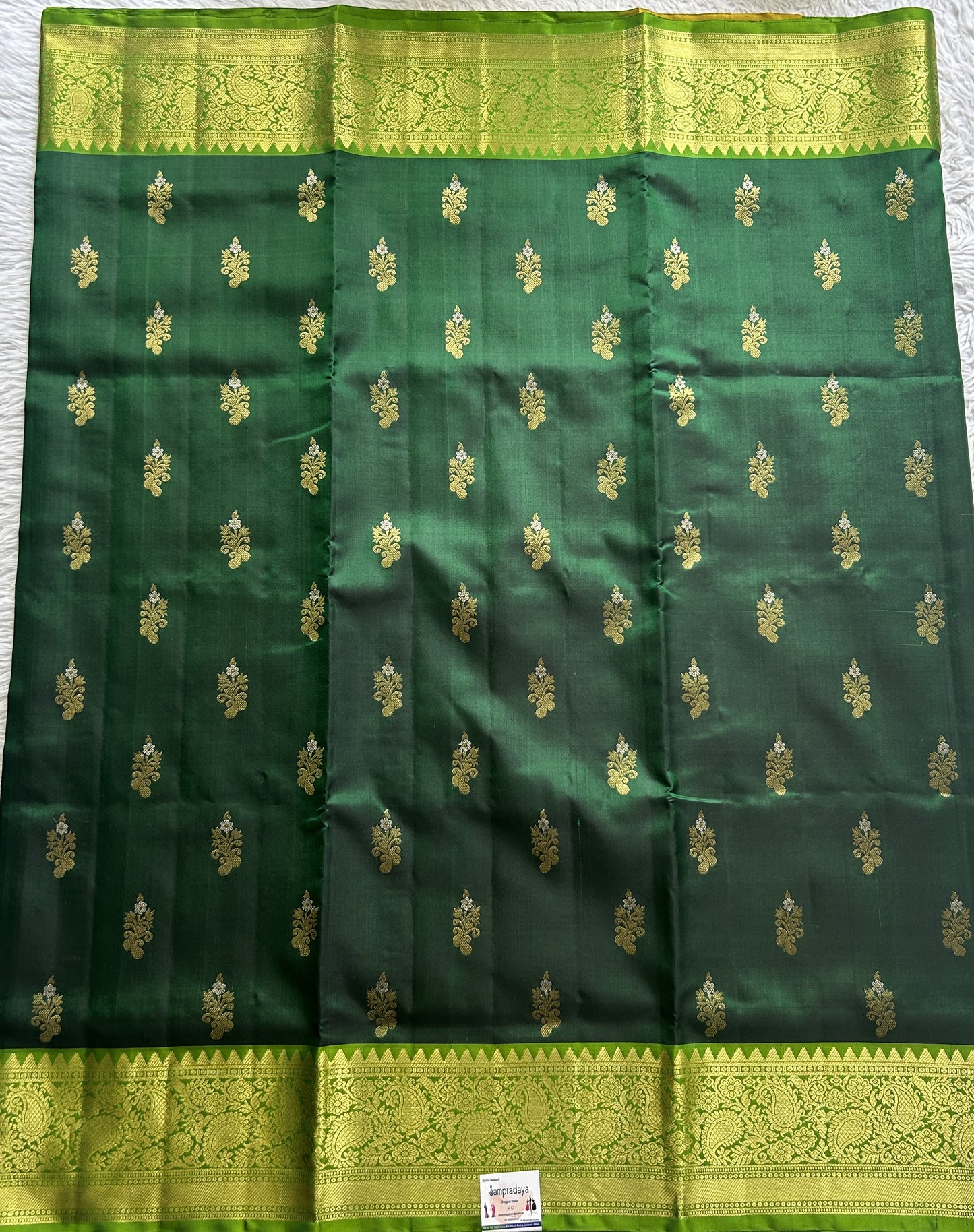 Venkatagiri Pattu Saree Dark Green Complemented With a Green Color Zari Border.