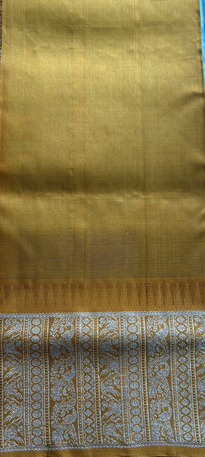 Venkatagiri Pattu Saree Sky Blue Complemented With a Mustard Color Zari Border.