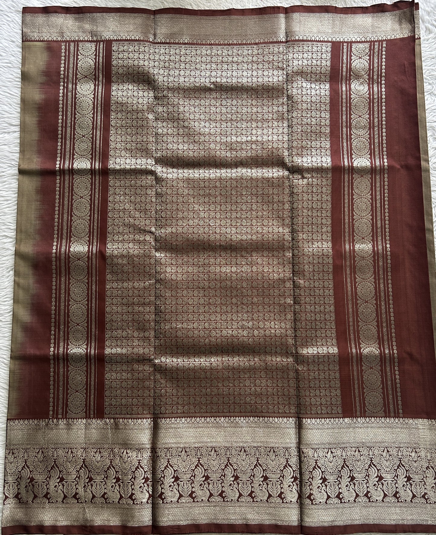 Venkatagiri Pattu Saree Olive Green Complemented With a Brown Color Zari Border.