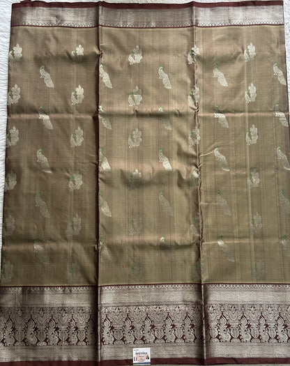 Venkatagiri Pattu Saree Olive Green Complemented With a Brown Color Zari Border.