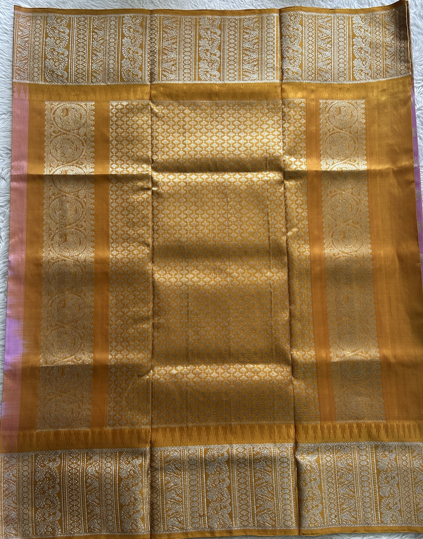 Venkatagiri Pattu Saree Baby Pink Complemented With a Mustard Color Zari Border.