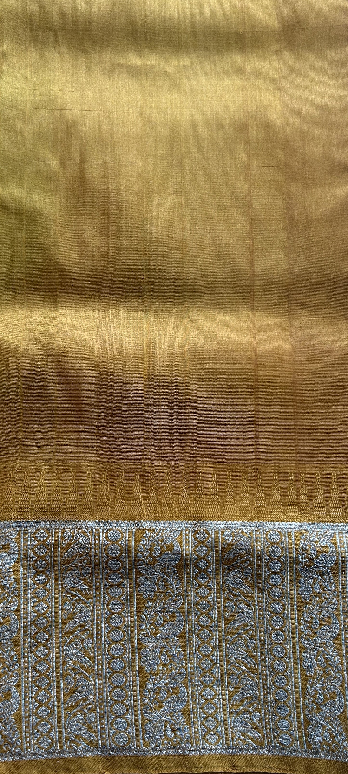 Venkatagiri Pattu Saree Baby Pink Complemented With a Mustard Color Zari Border.