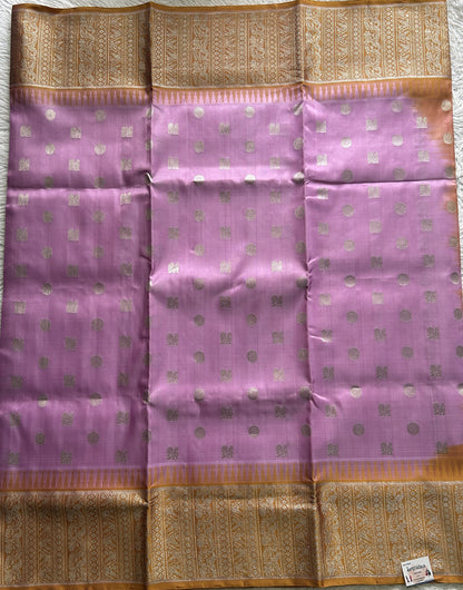 Venkatagiri Pattu Saree Baby Pink Complemented With a Mustard Color Zari Border.