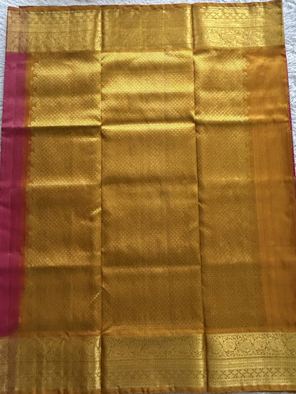 Venkatagiri Pattu Saree Pink Complemented With a Mustard Color Zari Border.