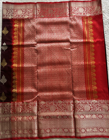 Venkatagiri Pattu Saree Brown Complemented With a Red Color Zari Border.