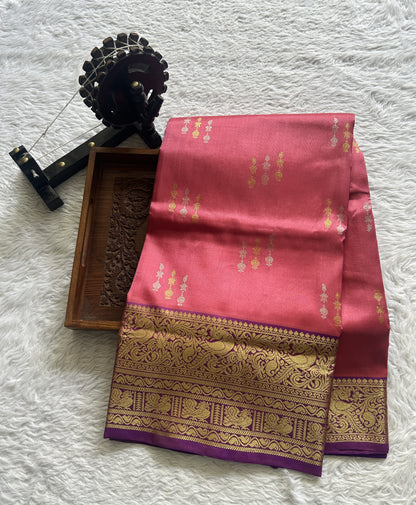 Venkatagiri Pattu Saree Pink Colored Complemented With a Violet Color Zari Border.