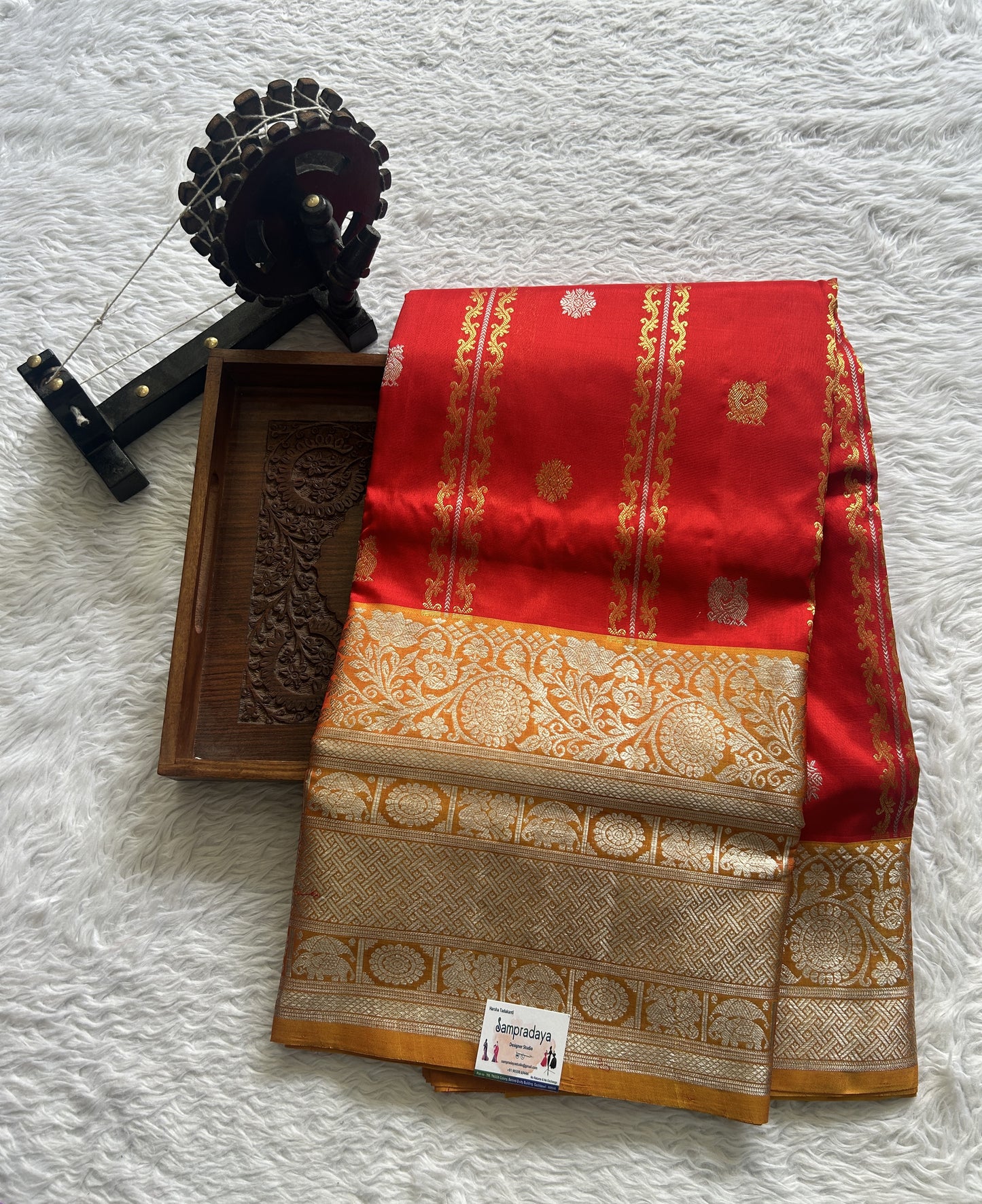 Venkatagiri Pattu Saree Red Colored Complemented With a Mustard Color Zari Border.