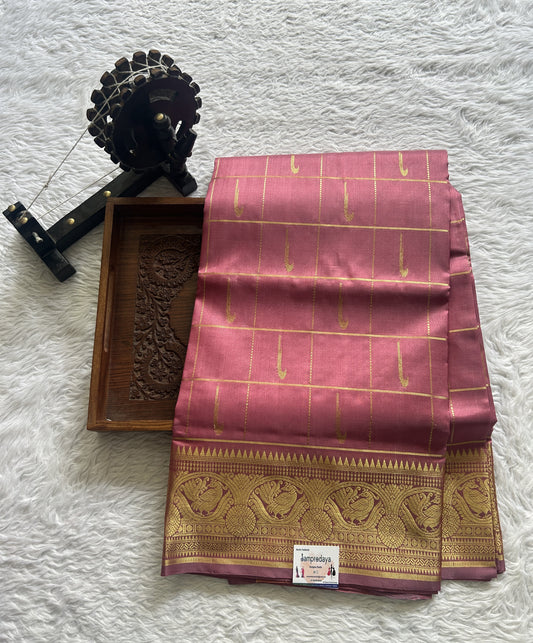 Venkatagiri Pattu Saree Pink Colored Complemented With a Zari Border.