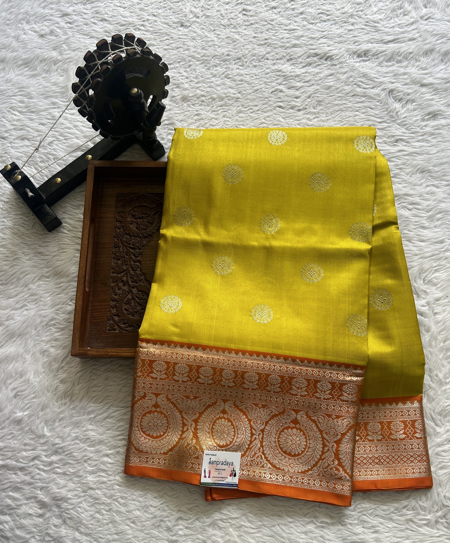 Venkatagiri Pattu Saree Yellow Colored Complemented With a Orange Color Zari Border.