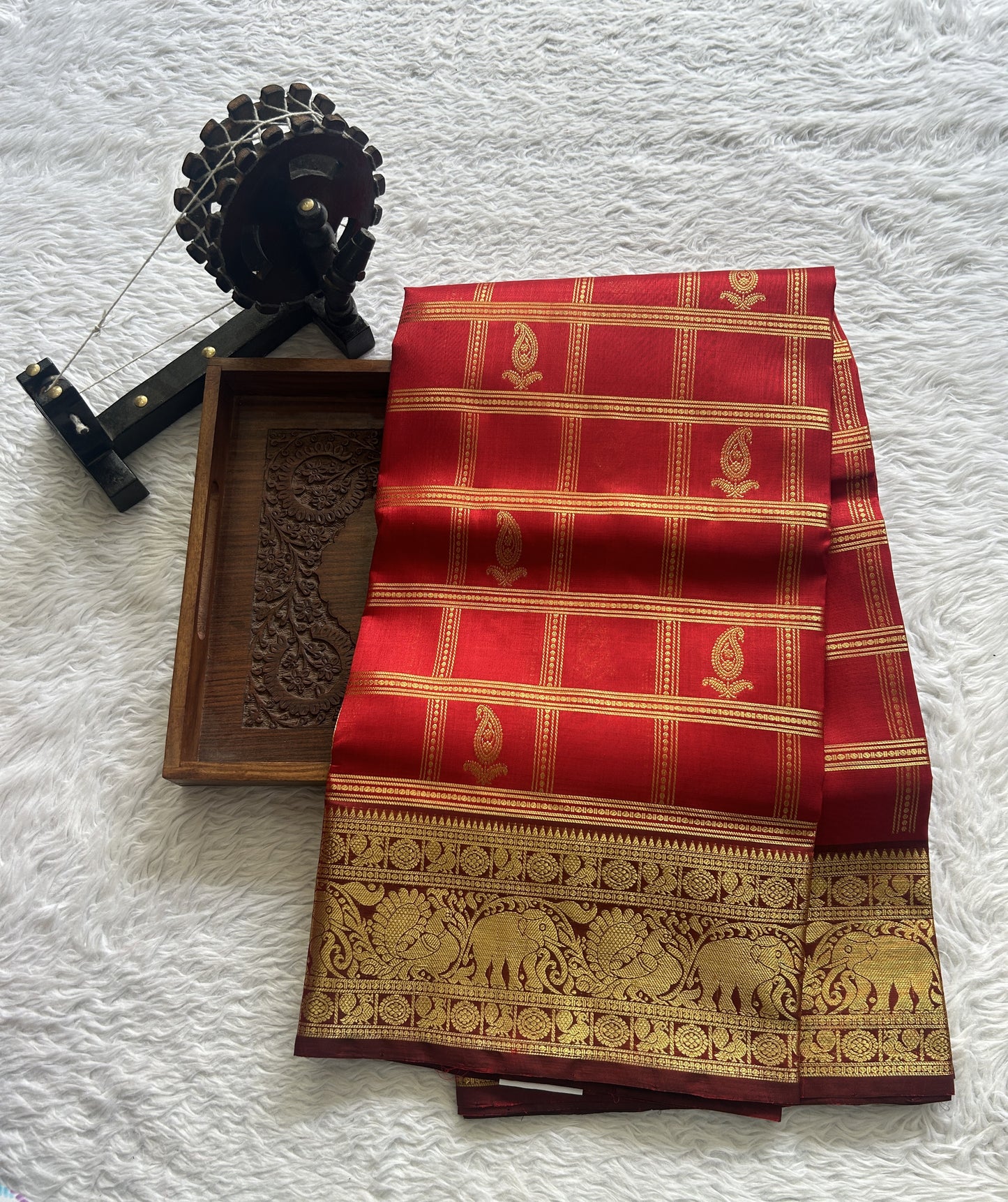 Venkatagiri Pattu Saree Red Colored Complemented With a Zari Border.