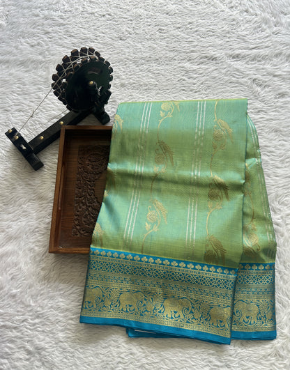 Venkatagiri Pattu Saree Light Green Colored Complemented With a Zari Border.