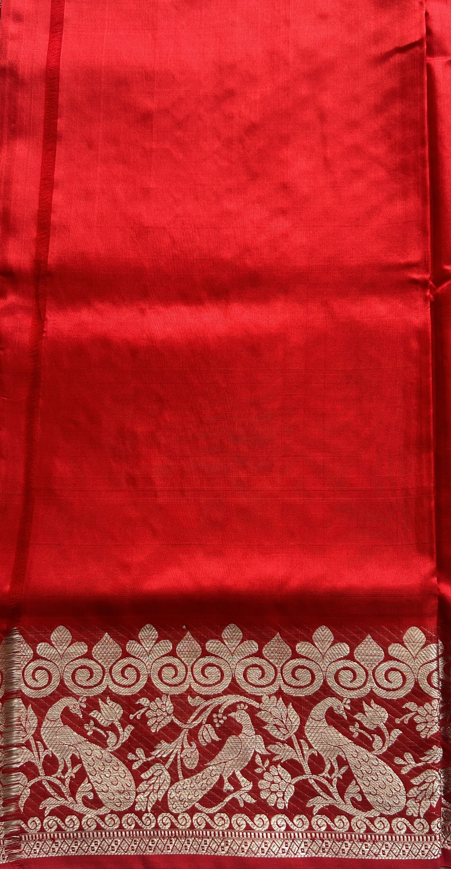 Venkatagiri Pattu Saree Red Colored Complemented With a Zari Border.