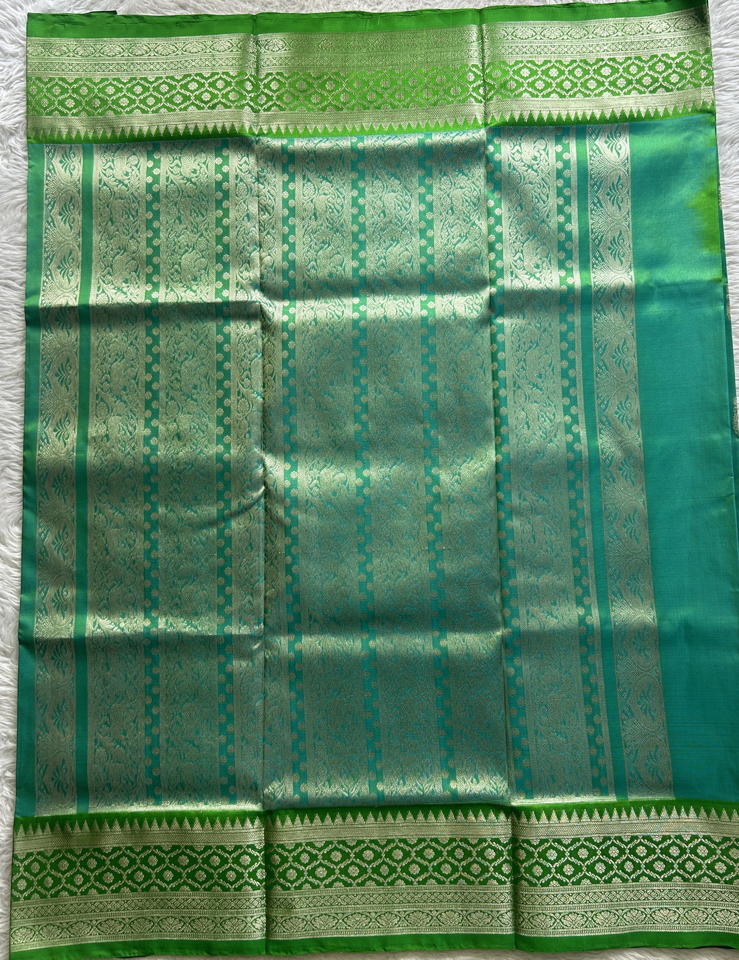 Venkatagiri Pattu Saree Rama Green Colored Complemented With a Zari Border.