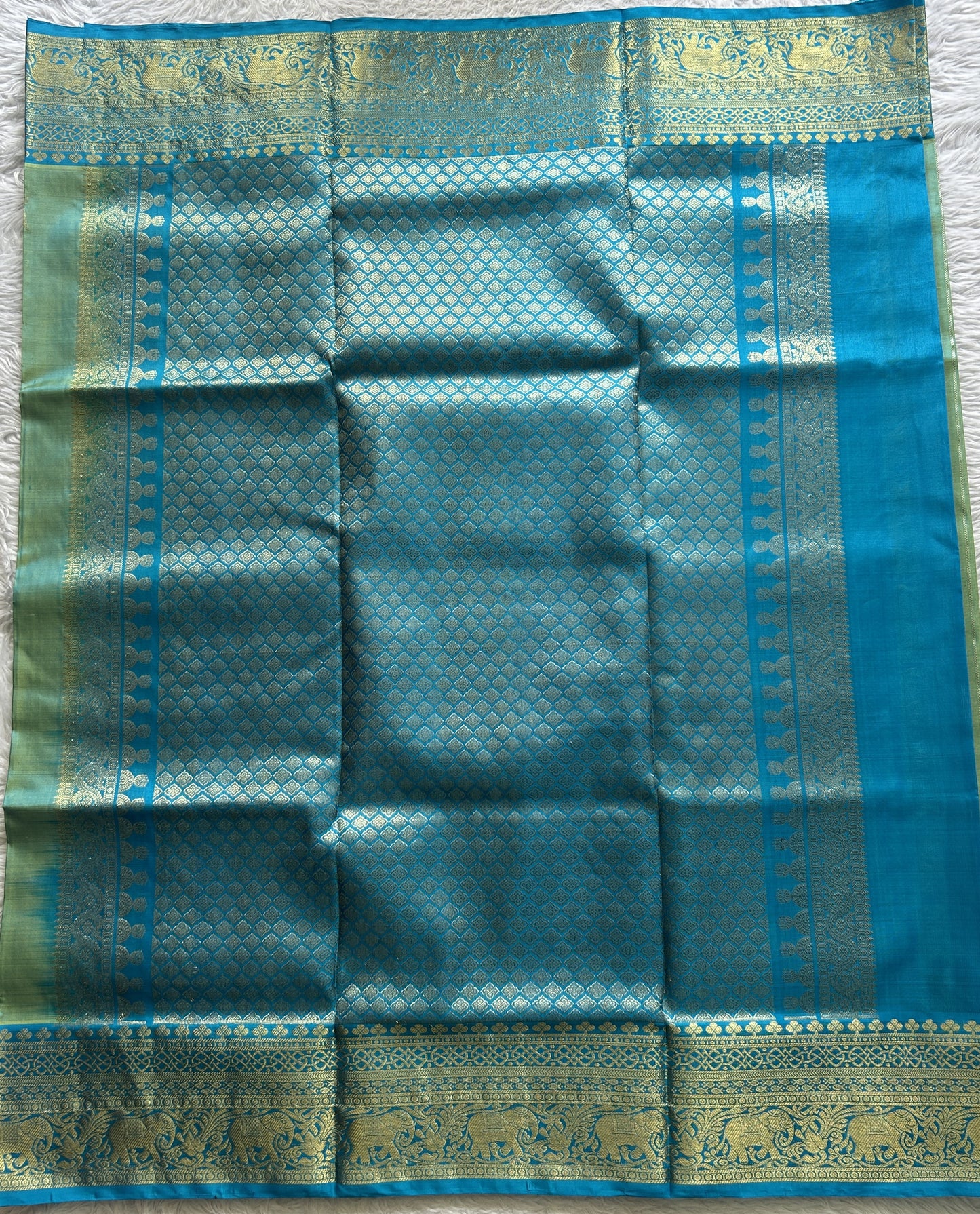 Venkatagiri Pattu Saree Light Green Colored Complemented With a Zari Border.