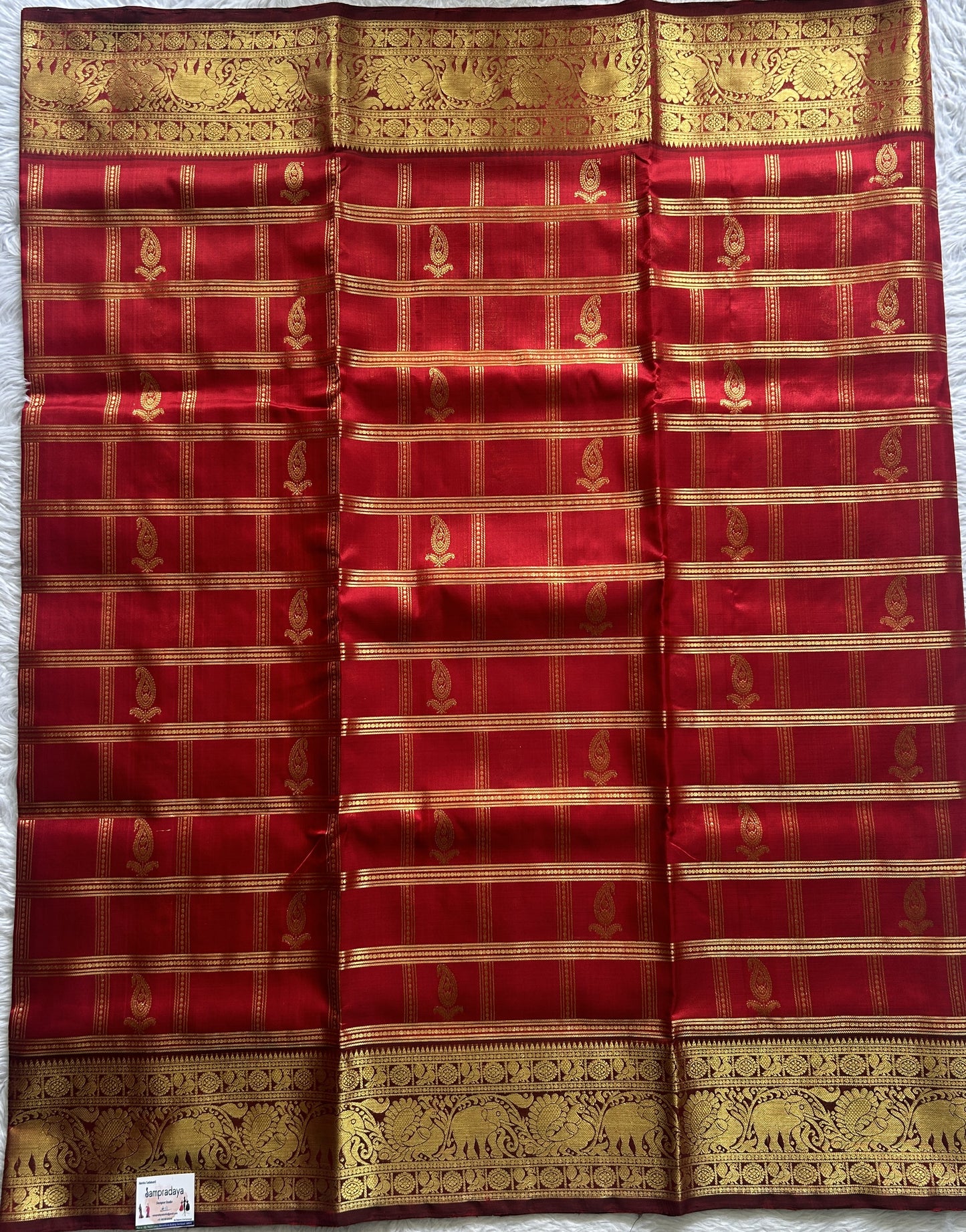 Venkatagiri Pattu Saree Red Colored Complemented With a Zari Border.