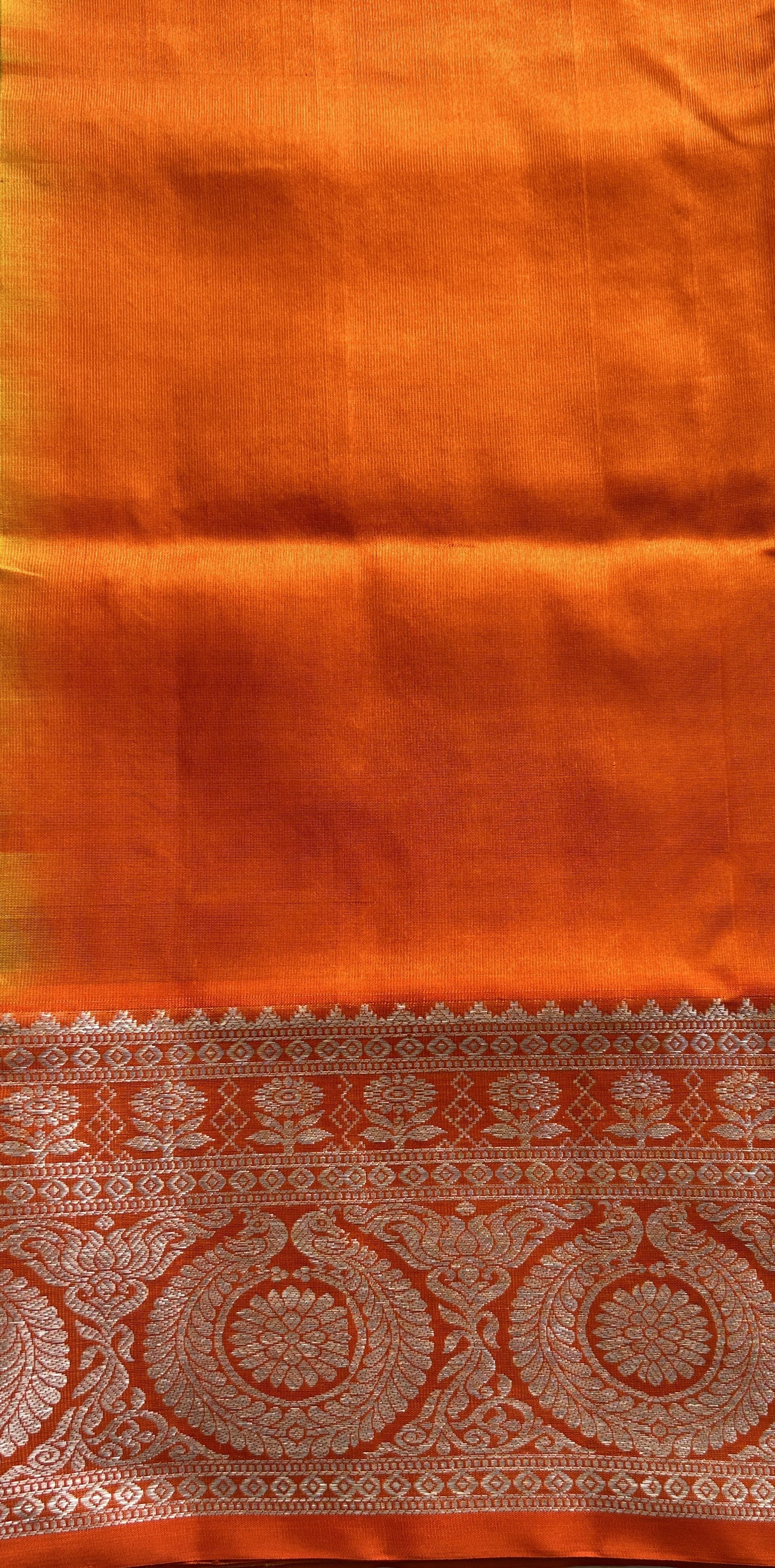 Venkatagiri Pattu Saree Yellow Colored Complemented With a Orange Color Zari Border.