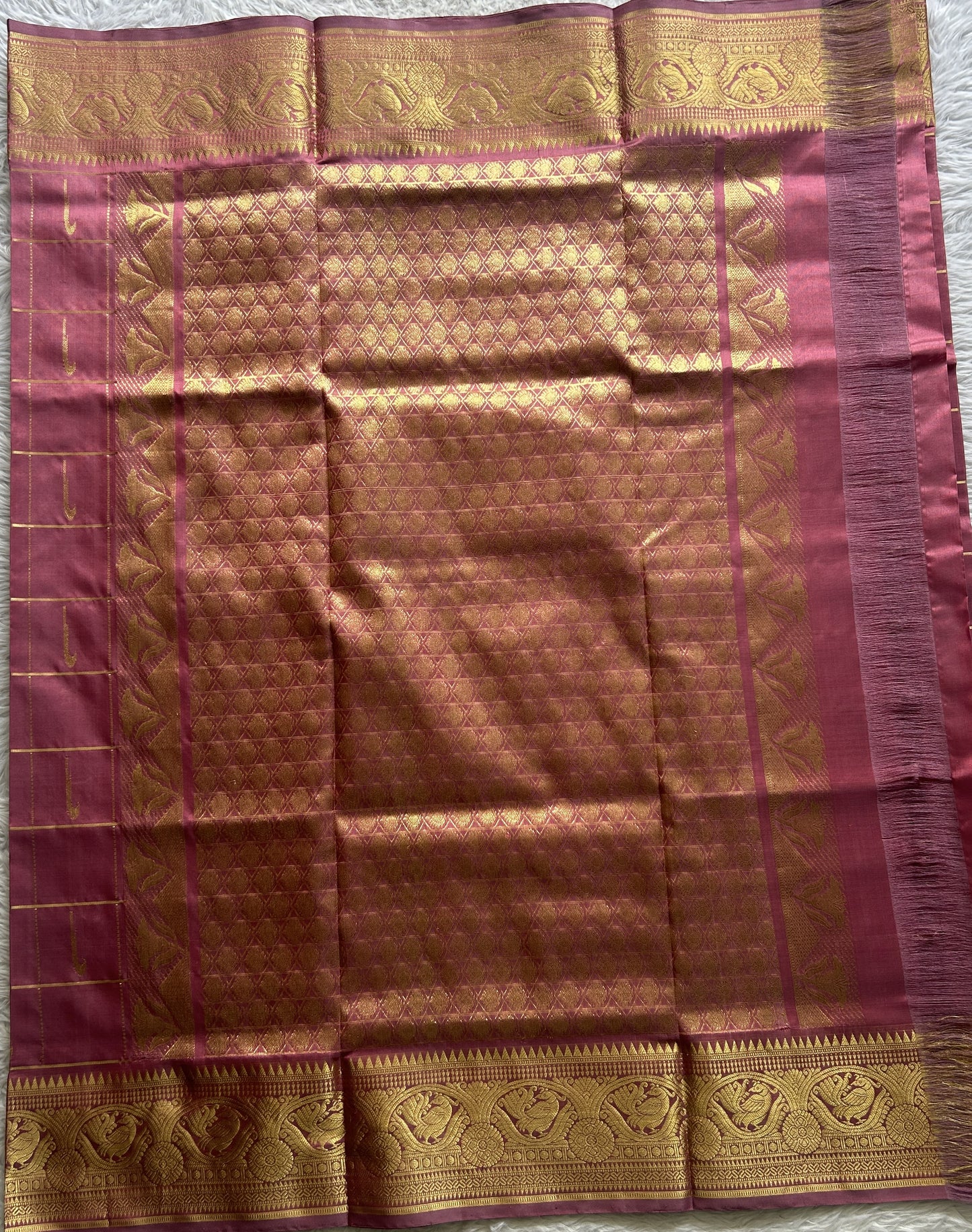 Venkatagiri Pattu Saree Pink Colored Complemented With a Zari Border.