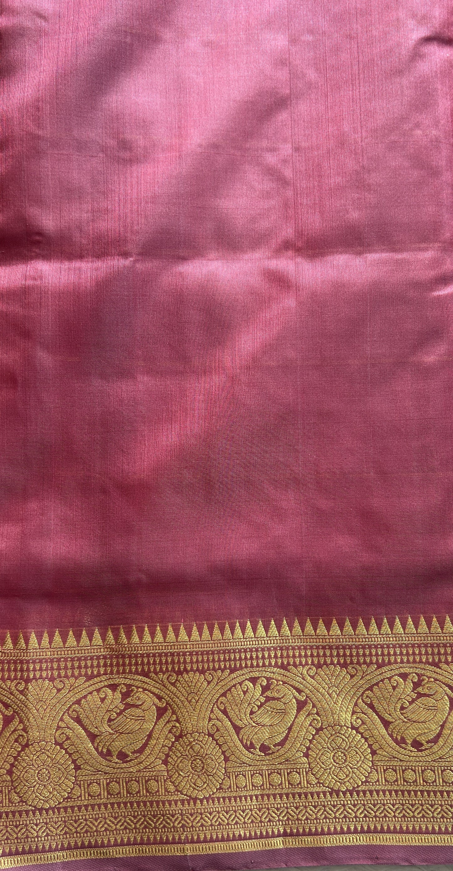 Venkatagiri Pattu Saree Pink Colored Complemented With a Zari Border.