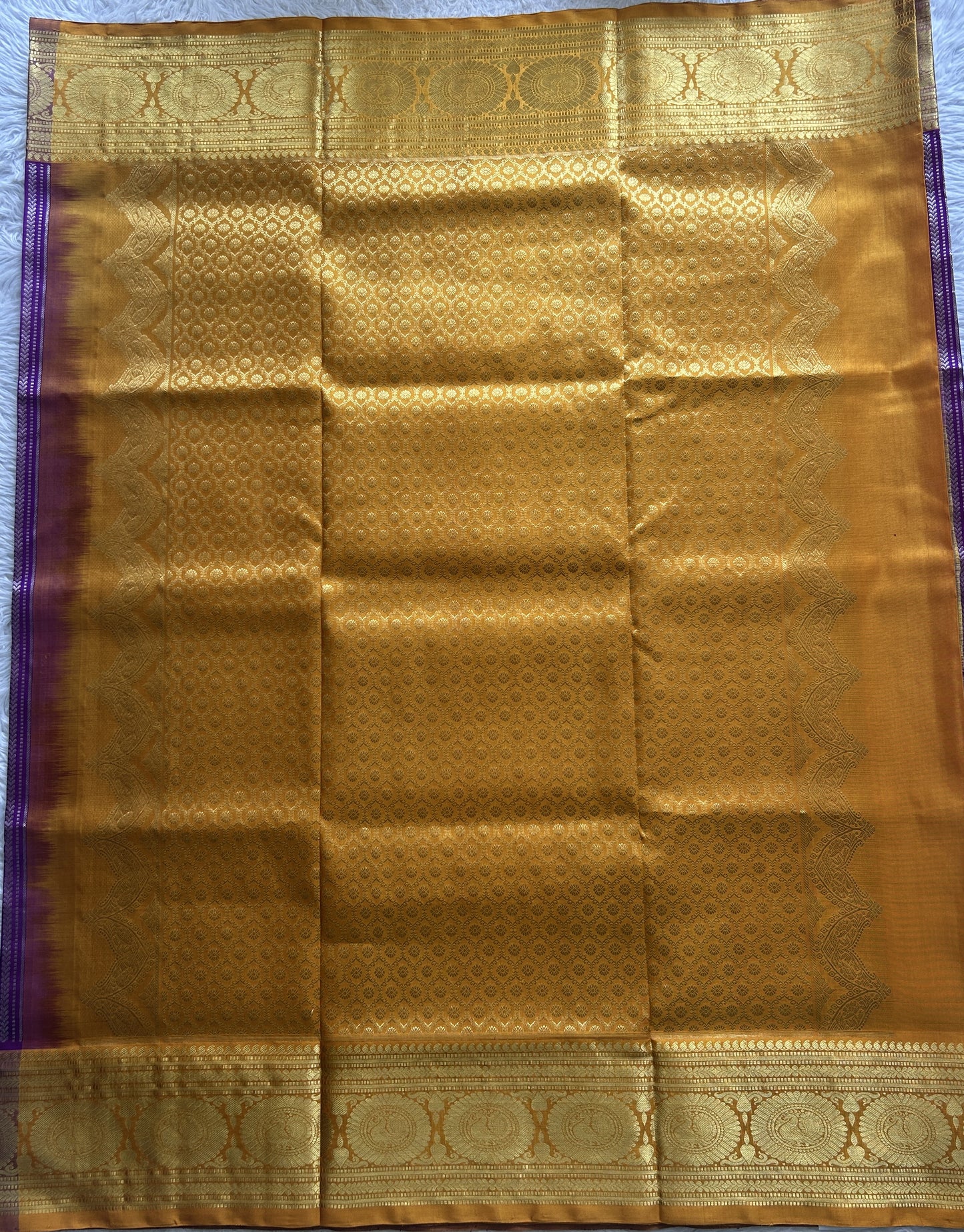 Venkatagiri Pattu Saree Violet Colored Complemented With a Light Apricot Color Zari Border.