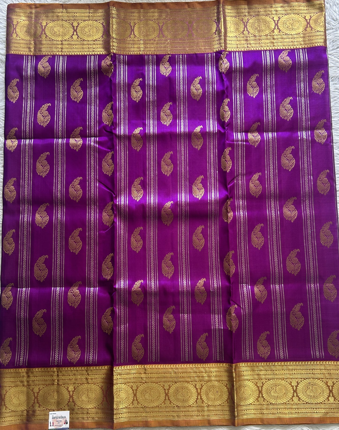 Venkatagiri Pattu Saree Violet Colored Complemented With a Light Apricot Color Zari Border.