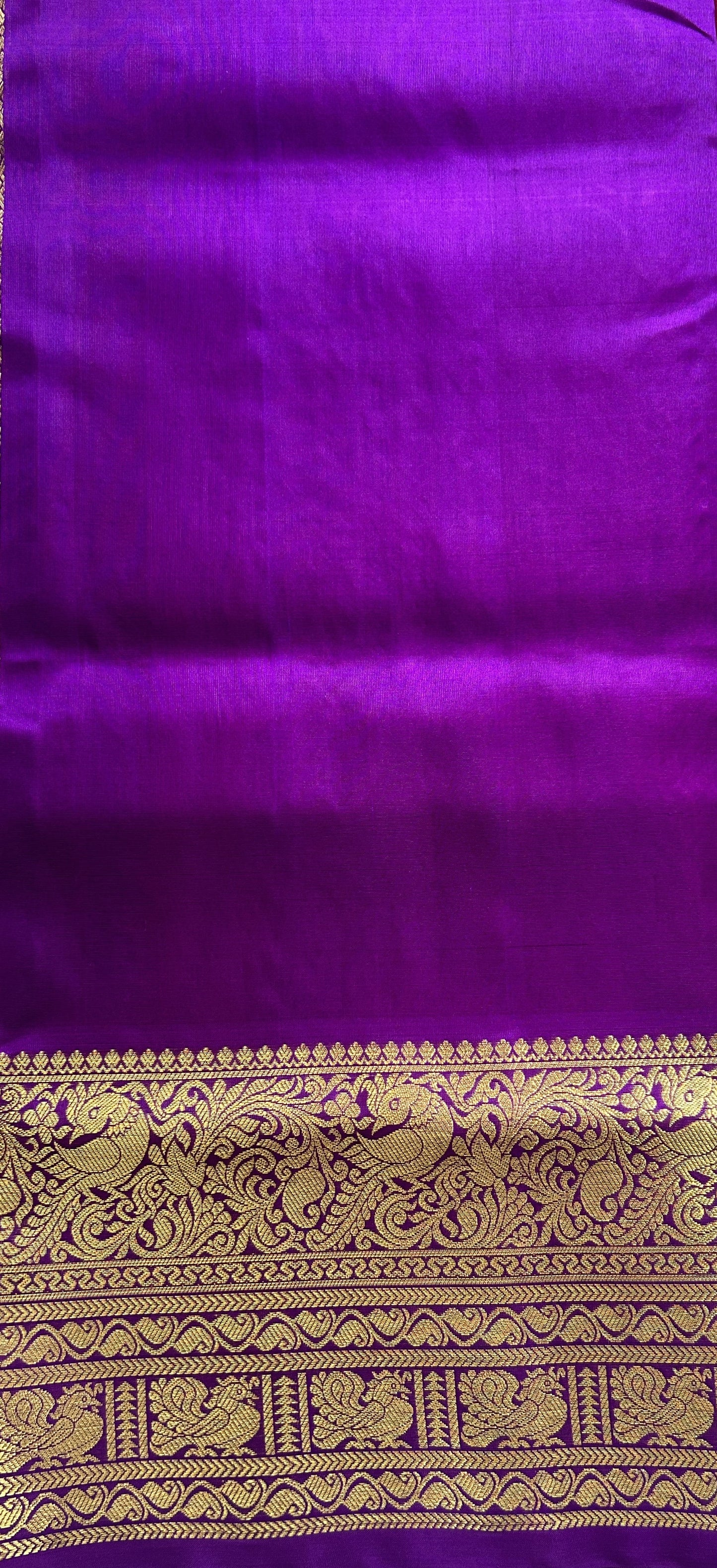 Venkatagiri Pattu Saree Pink Colored Complemented With a Violet Color Zari Border.