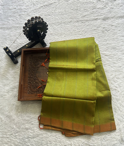 Mangalagiri Plain Pattu Saree Light Green colored complemented with a No Border.