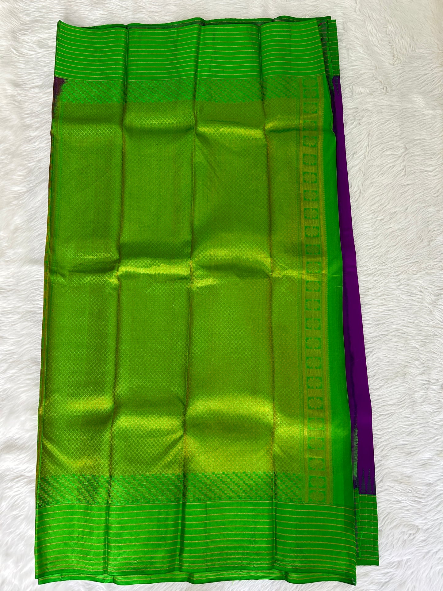 Gadwal Pattu Saree Purple-colored saree complemented with a Grass Green border - Sampradaya Designer Studio