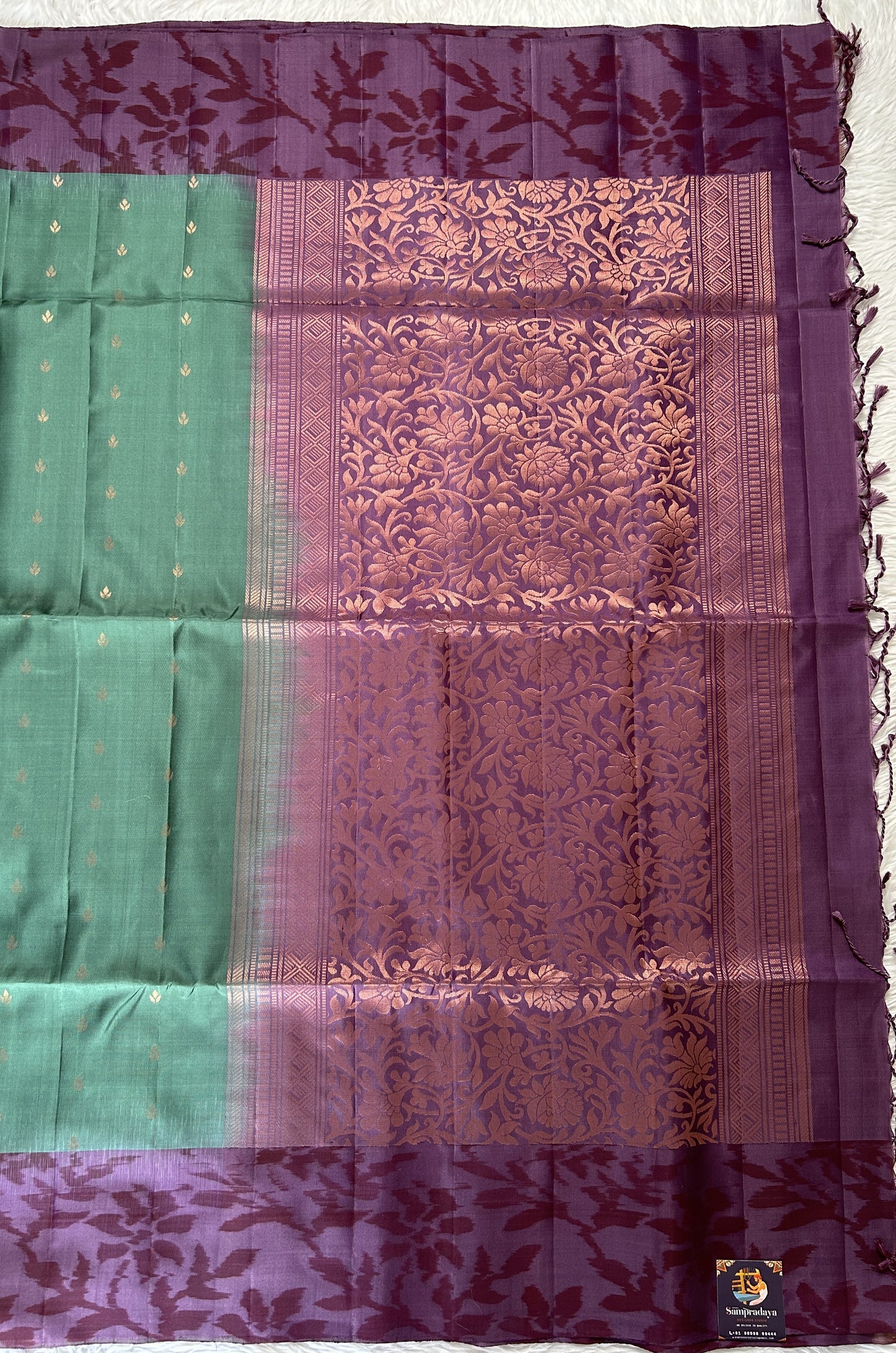 Kanjivaram Festive Soft Silk Saree Bottle Green colored Saree complemented with a Violet Colored Pochampally border. - Sampradaya Designer Studio