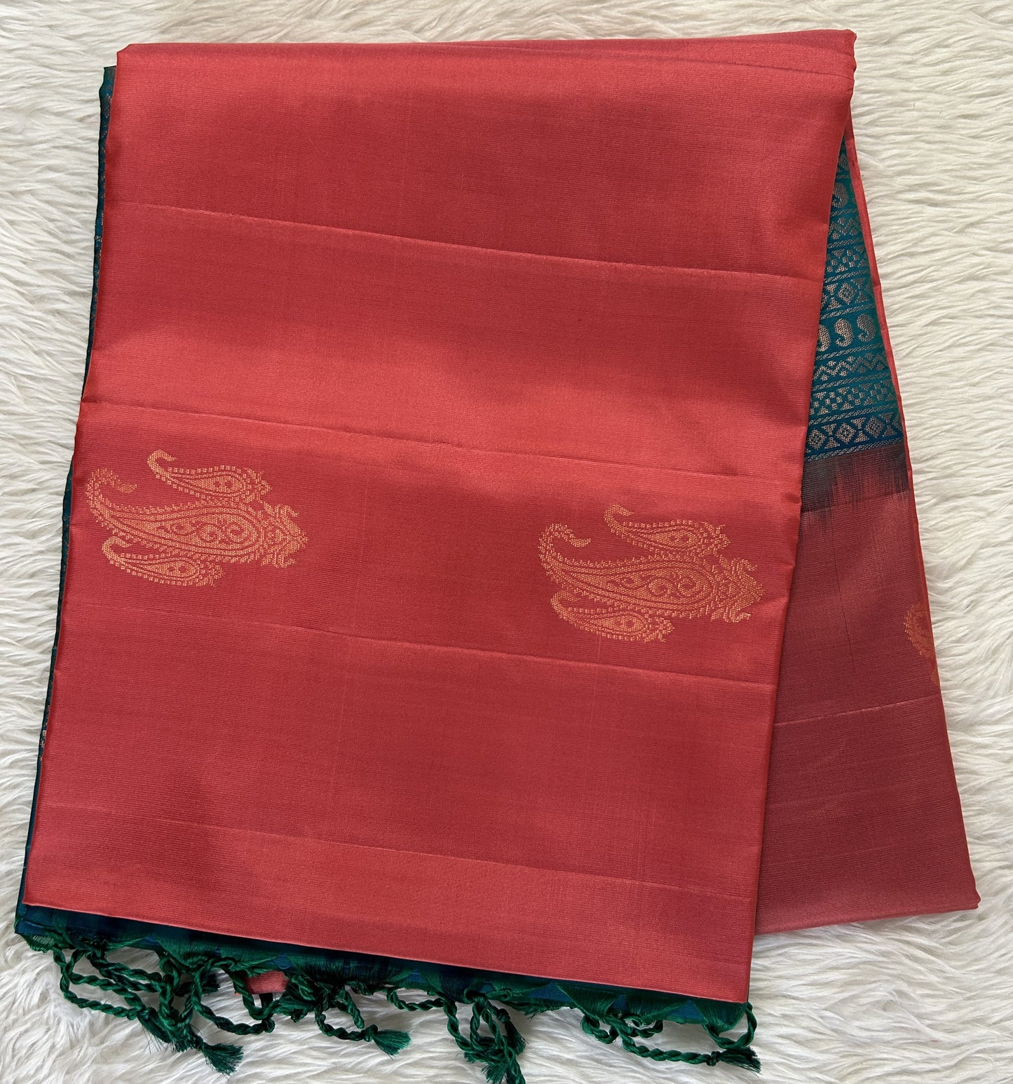 Kanjivaram Festive Soft Silk Saree Coral Pink colored Saree complemented with a Peacock Blue Colored Pochampally border. - Sampradaya Designer Studio