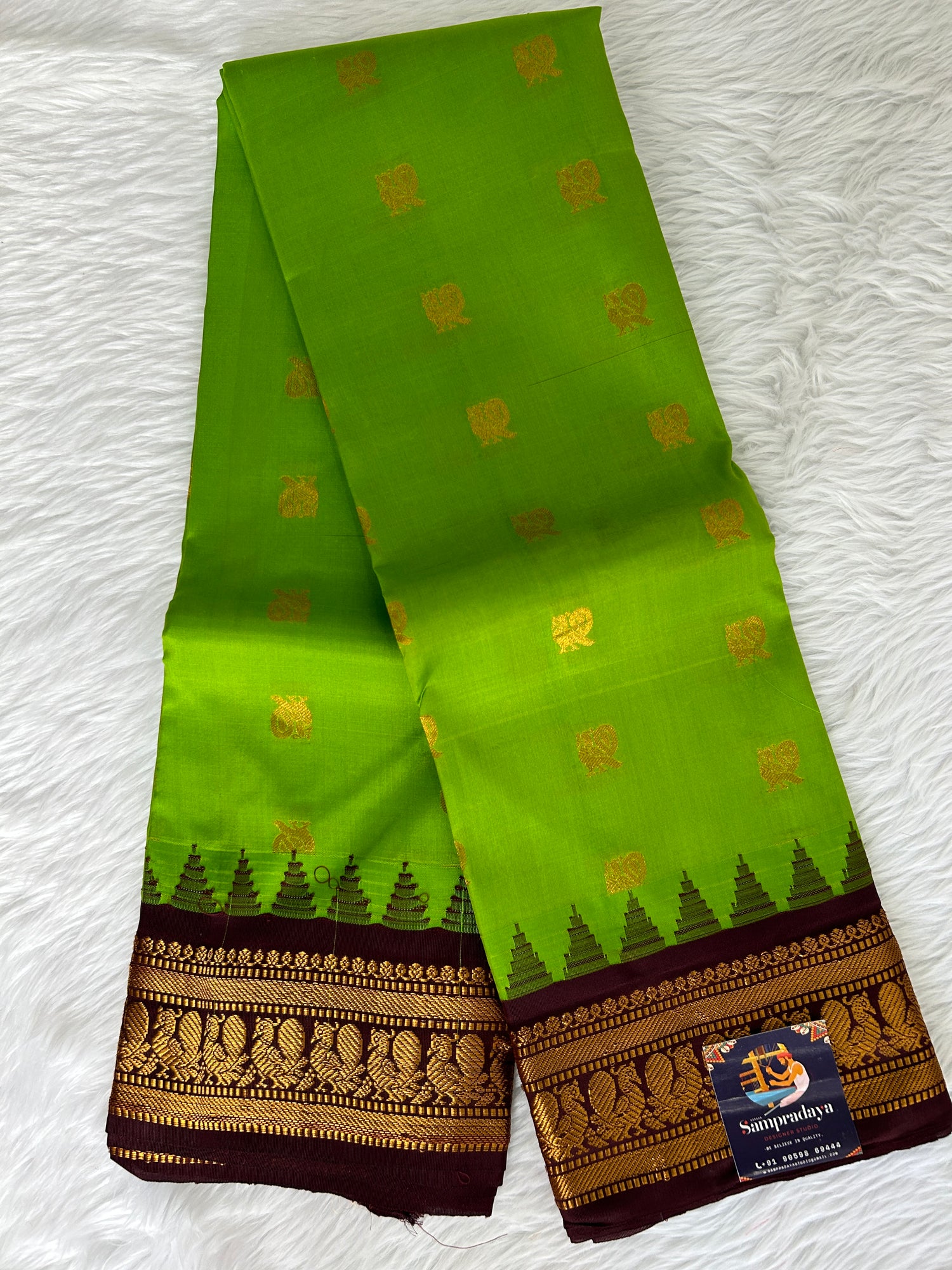 Gadwal Pattu Saree Apple Green colored saree complemented with a Coffee Brown Kanchi border - Sampradaya Designer Studio