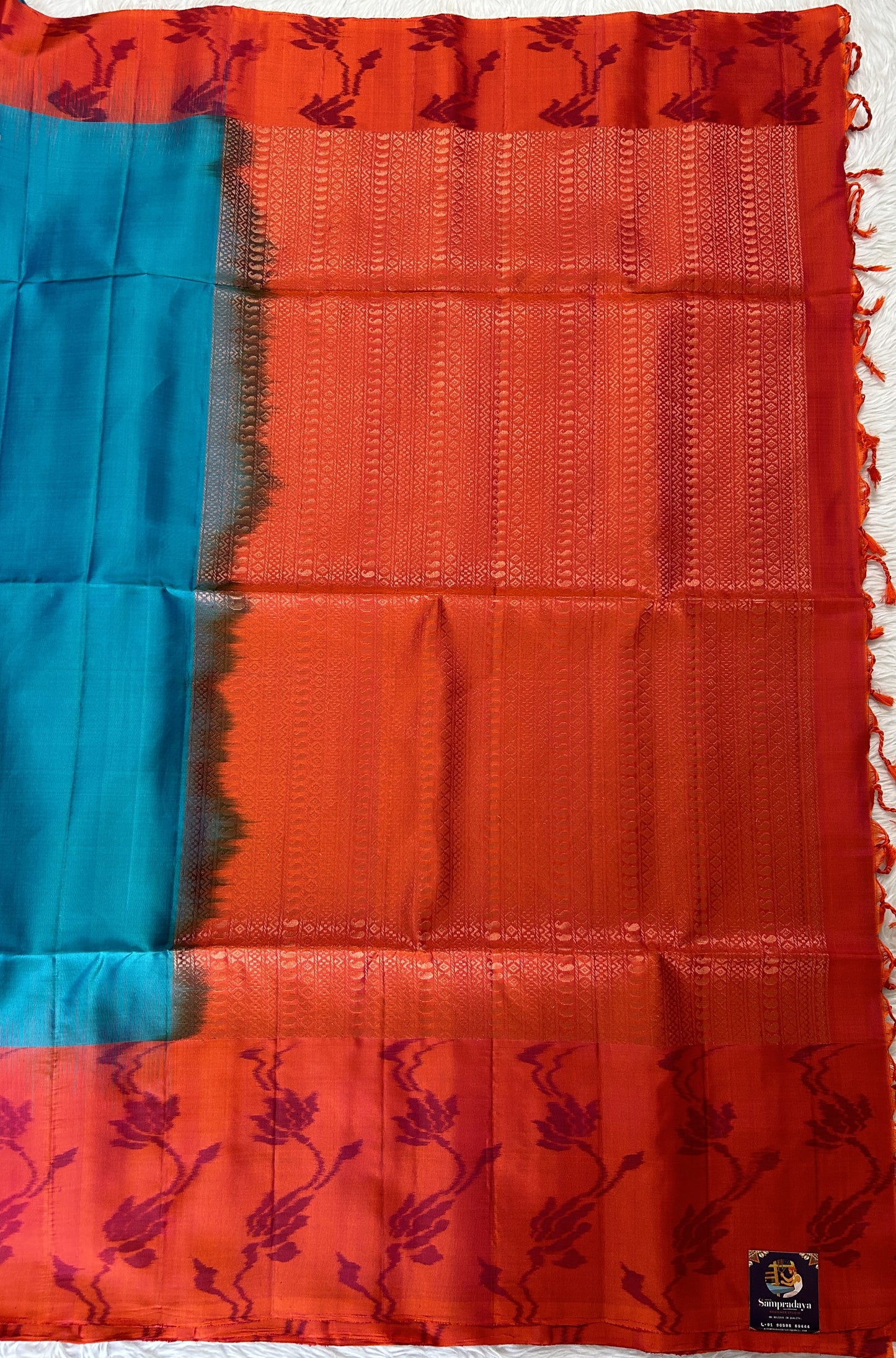 Kanjivaram Festive Soft Silk Saree Blue colored Saree complemented with a Orange Pochampally border. - Sampradaya Designer Studio