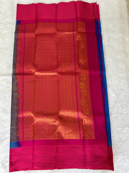 Gadwal Pattu Saree Rama Blue colored saree complemented with a Pink Kanchi border - Sampradaya Designer Studio