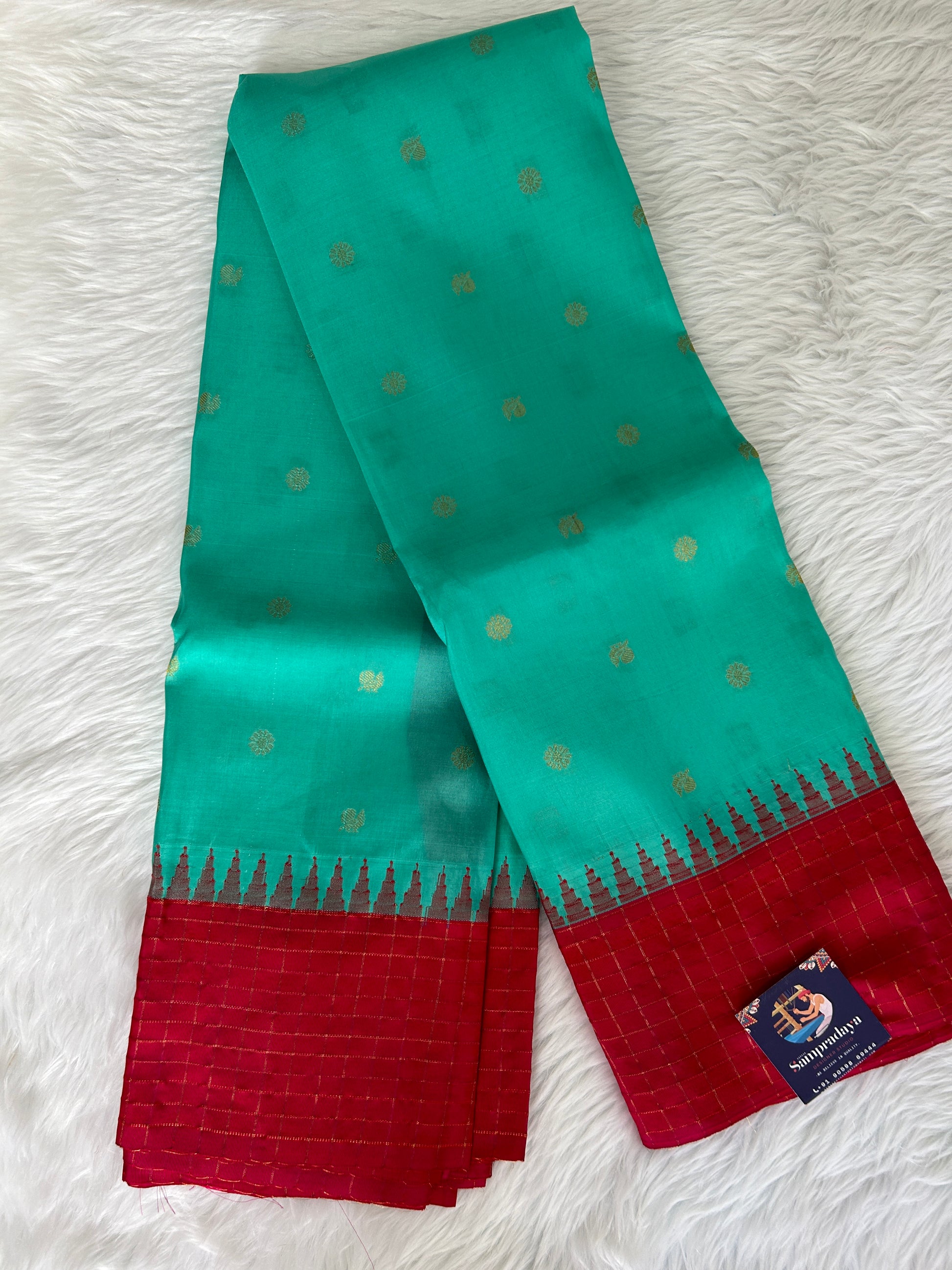 Gadwal Pattu Saree Sea Green colored saree complemented with a Rani Pink checks border - Sampradaya Designer Studio